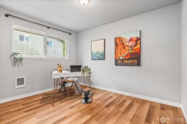 2042 E Harrison St, Tacoma, WA 98404 - office space with baseboards, wood finished floors, and heating unit