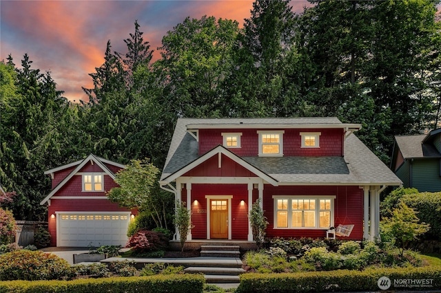 9385 NE N Town Loop, Bainbridge Island, WA 98110 - craftsman inspired home featuring a garage, a porch, a shingled roof, and driveway