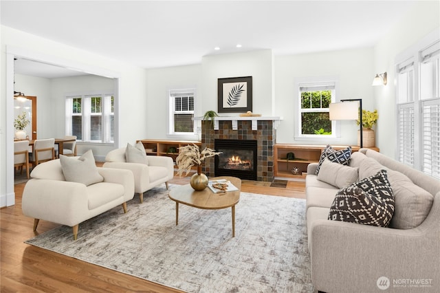9385 NE N Town Loop, Bainbridge Island, WA 98110 - living room featuring wood finished floors, a fireplace, and recessed lighting