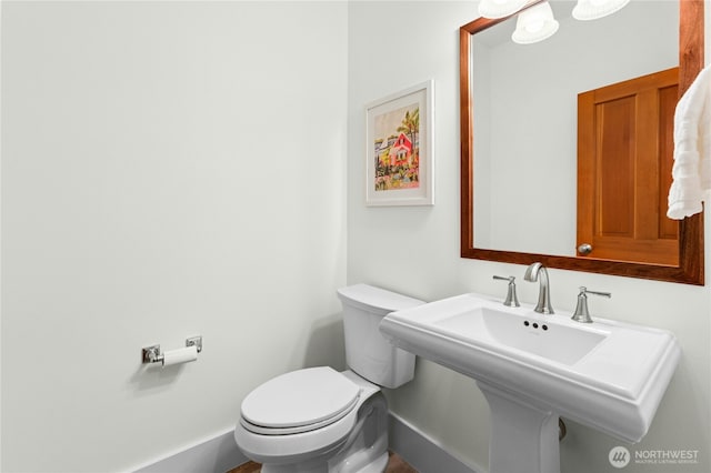 9385 NE N Town Loop, Bainbridge Island, WA 98110 - half bathroom with toilet, baseboards, and a sink
