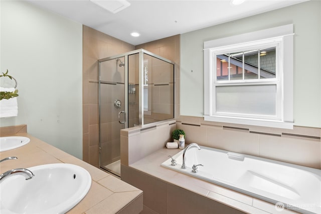 9385 NE N Town Loop, Bainbridge Island, WA 98110 - full bathroom featuring a shower stall, a bath, double vanity, and recessed lighting