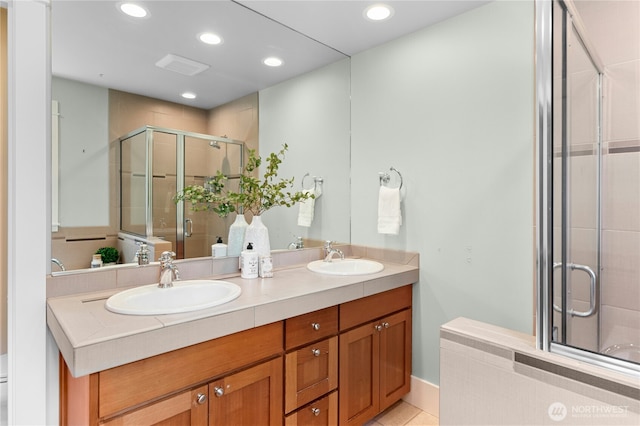 9385 NE N Town Loop, Bainbridge Island, WA 98110 - bathroom featuring double vanity, a stall shower, recessed lighting, and tile patterned flooring