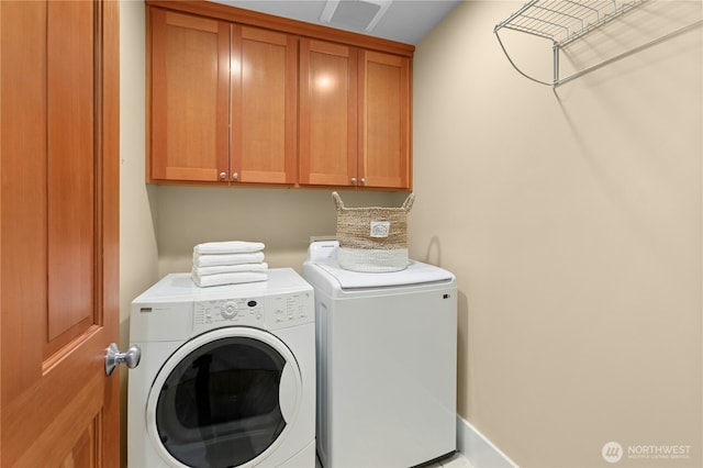 9385 NE N Town Loop, Bainbridge Island, WA 98110 - washroom with cabinet space and washer and dryer