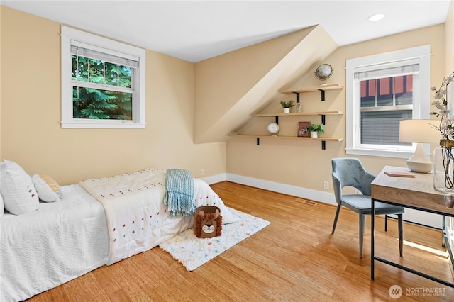 9385 NE N Town Loop, Bainbridge Island, WA 98110 - bedroom with wood finished floors, baseboards, and recessed lighting