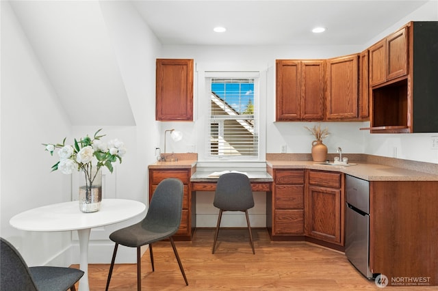 9385 NE N Town Loop, Bainbridge Island, WA 98110 - kitchen featuring a sink, light wood-style flooring, refrigerator, brown cabinetry, and recessed lighting