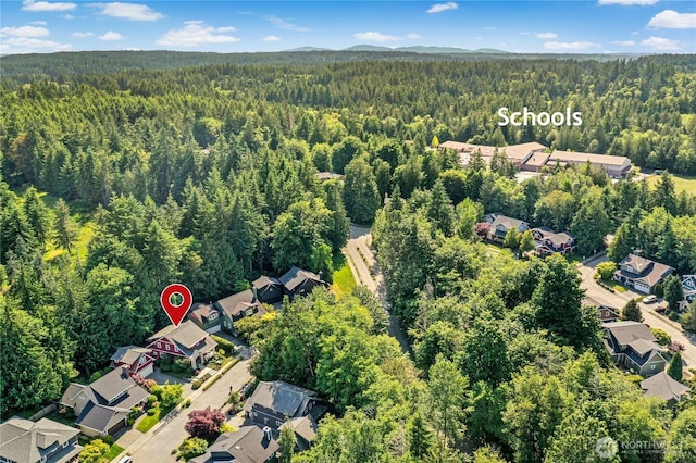 9385 NE N Town Loop, Bainbridge Island, WA 98110 - aerial view of residential area featuring a heavily wooded area