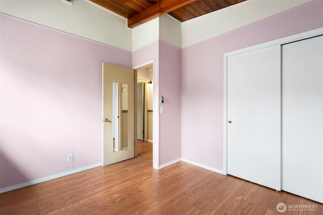1240 Beach Dr, Camano Island, WA 98282 - unfurnished bedroom featuring wood ceiling, wood finished floors, baseboards, and a closet