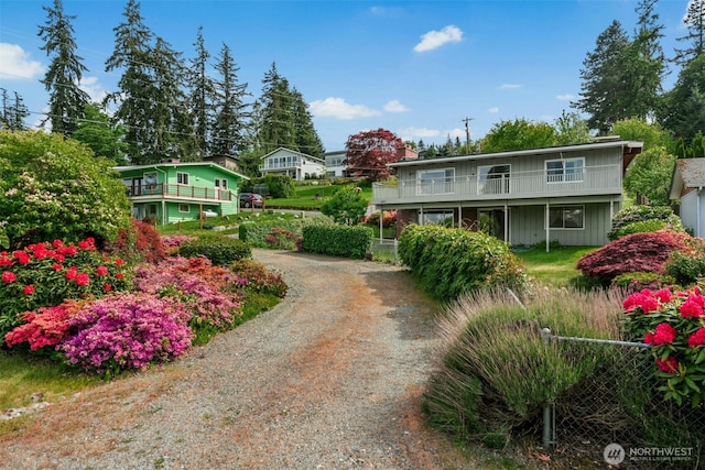 1240 Beach Dr, Camano Island, WA 98282 - view of front of house with driveway and a balcony