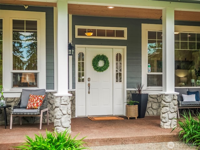 20409 70th St E, Bonney Lake, WA 98391 - view of exterior entry with covered porch and stone siding