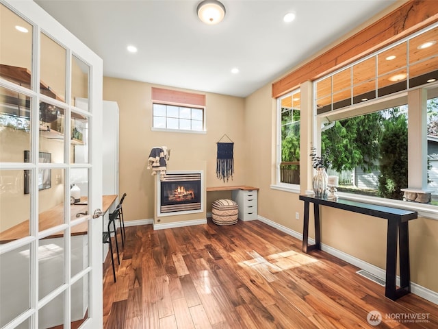 20409 70th St E, Bonney Lake, WA 98391 - office area with a glass covered fireplace, wood finished floors, baseboards, and recessed lighting
