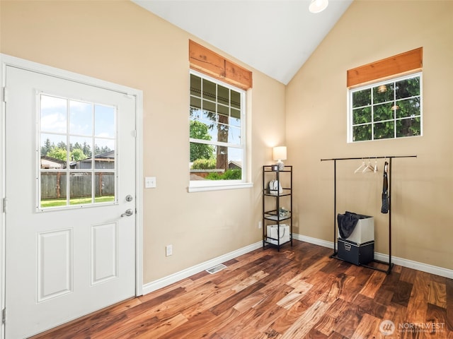 20409 70th St E, Bonney Lake, WA 98391 - entryway featuring vaulted ceiling, wood finished floors, and baseboards