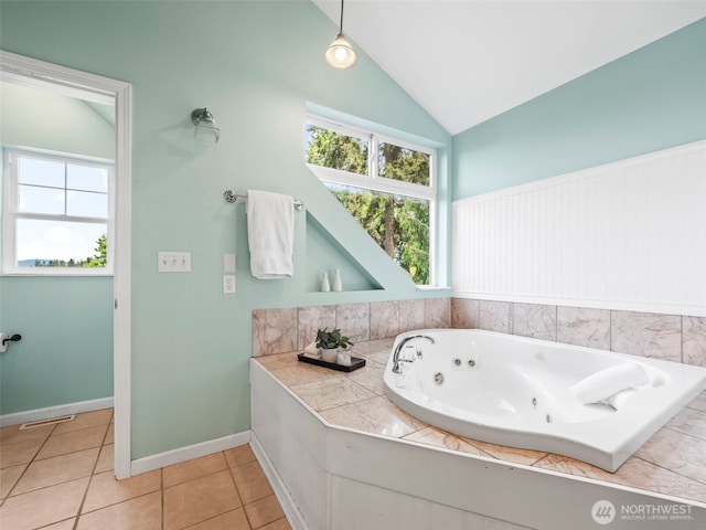 20409 70th St E, Bonney Lake, WA 98391 - full bath with a whirlpool tub, tile patterned flooring, lofted ceiling, and baseboards