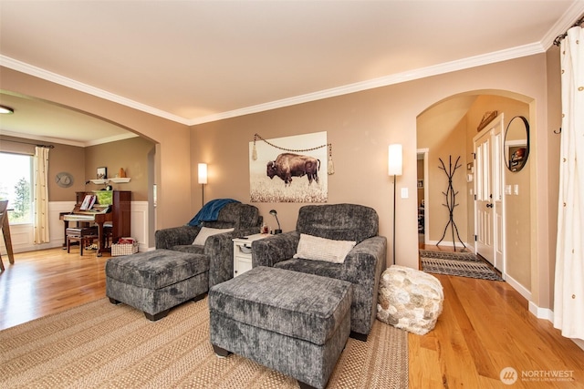 1063 Tamarack Ln, Port Angeles, WA 98362 - living room with arched walkways, light wood finished floors, and crown molding