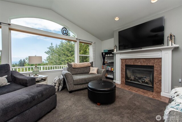 1063 Tamarack Ln, Port Angeles, WA 98362 - tiled living room with lofted ceiling, a tile fireplace, and recessed lighting