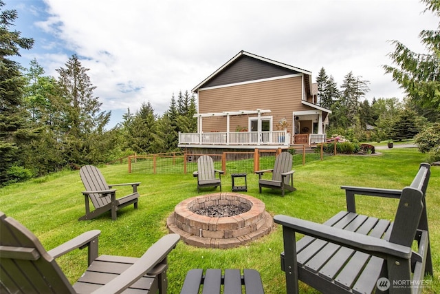 1063 Tamarack Ln, Port Angeles, WA 98362 - back of house featuring an outdoor fire pit, a lawn, and a deck