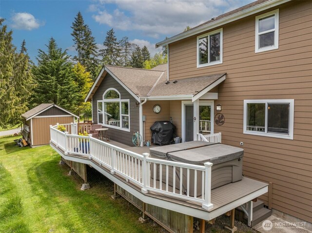 1063 Tamarack Ln, Port Angeles, WA 98362 - rear view of house with a wooden deck, a lawn, a hot tub, roof with shingles, and a shed