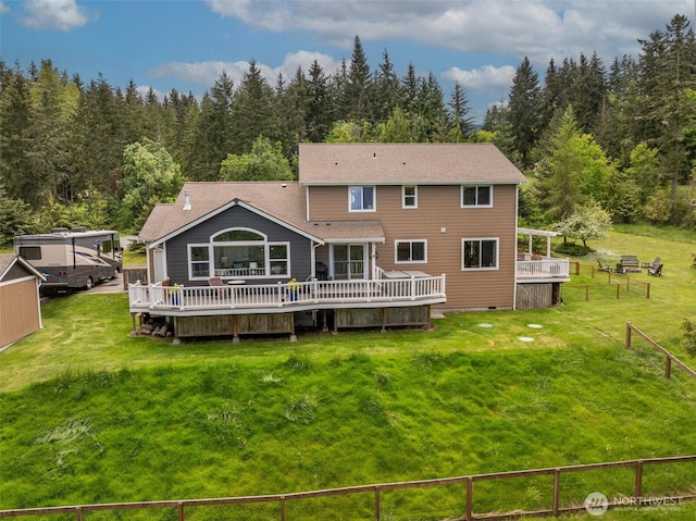 1063 Tamarack Ln, Port Angeles, WA 98362 - back of house featuring a wooden deck, a wooded view, and crawl space