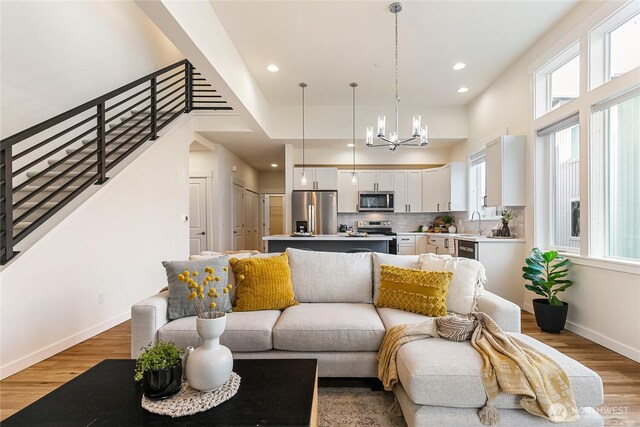 4246 Cameo Ln, Bellingham, WA 98226 - living area featuring light wood-style floors, a chandelier, healthy amount of natural light, and recessed lighting
