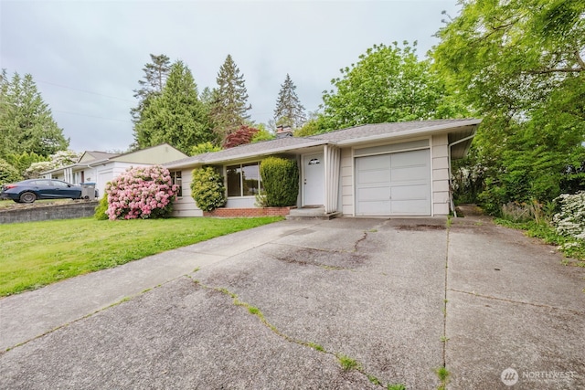 2409 Veldee Ave, Bremerton, WA 98312 - single story home featuring asphalt driveway, a garage, a front lawn, and a chimney