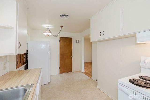 2409 Veldee Ave, Bremerton, WA 98312 - kitchen featuring white appliances, white cabinets, light countertops, and a sink