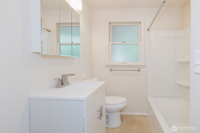 2409 Veldee Ave, Bremerton, WA 98312 - bathroom with toilet, vanity, shower / tub combination, and baseboards