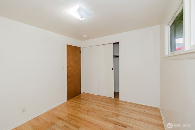2409 Veldee Ave, Bremerton, WA 98312 - unfurnished bedroom with light wood finished floors, baseboards, and a closet