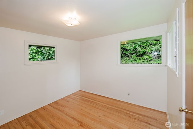 2409 Veldee Ave, Bremerton, WA 98312 - empty room with plenty of natural light, light wood-style flooring, and baseboards