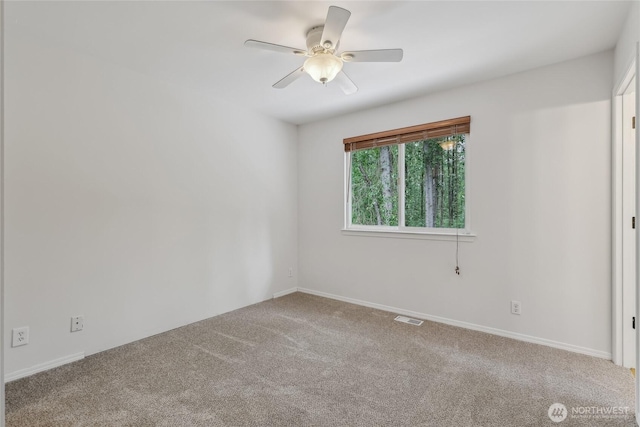 12721 56th Dr NE, Marysville, WA 98271 - spare room with carpet flooring, a ceiling fan, and baseboards