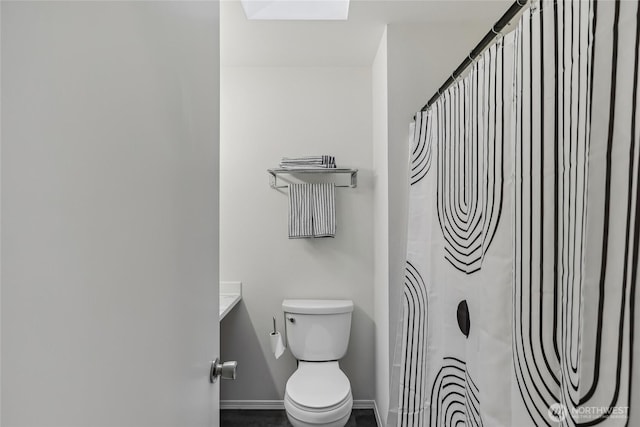 12721 56th Dr NE, Marysville, WA 98271 - bathroom with toilet, a shower with shower curtain, vanity, and baseboards