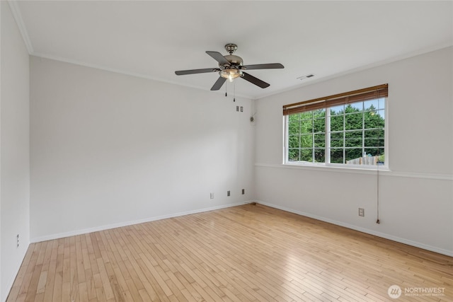 12721 56th Dr NE, Marysville, WA 98271 - empty room with wood finished floors, ceiling fan, baseboards, and crown molding