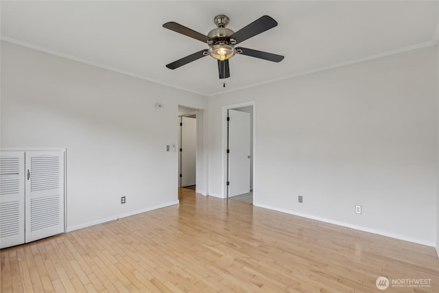 12721 56th Dr NE, Marysville, WA 98271 - empty room with ornamental molding, ceiling fan, wood finished floors, and baseboards