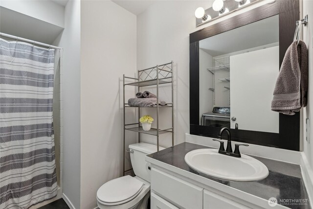 12721 56th Dr NE, Marysville, WA 98271 - full bath featuring washer / dryer, toilet, vanity, and curtained shower