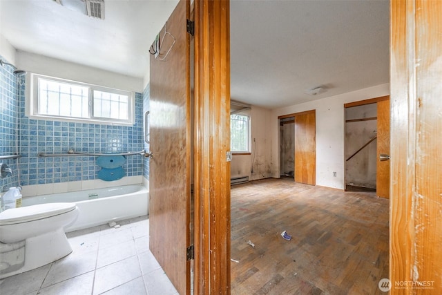 1216 E 70th St, Tacoma, WA 98404 - bathroom featuring toilet, baseboard heating, tub / shower combination, and tile patterned flooring