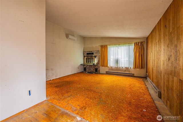 1216 E 70th St, Tacoma, WA 98404 - unfurnished living room with a baseboard heating unit, a wall unit AC, lofted ceiling, and baseboard heating