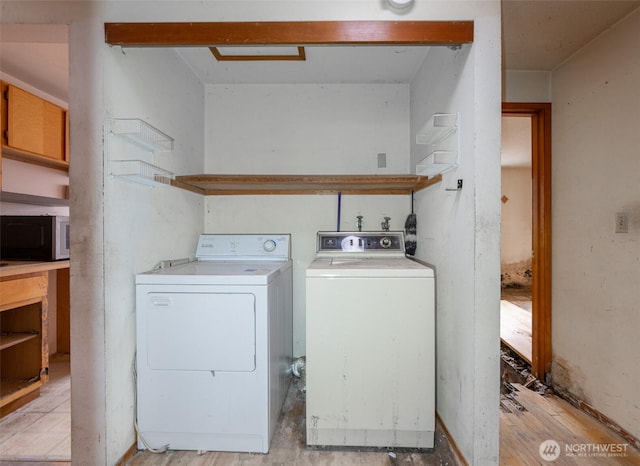 1216 E 70th St, Tacoma, WA 98404 - laundry room featuring independent washer and dryer and light wood-type flooring