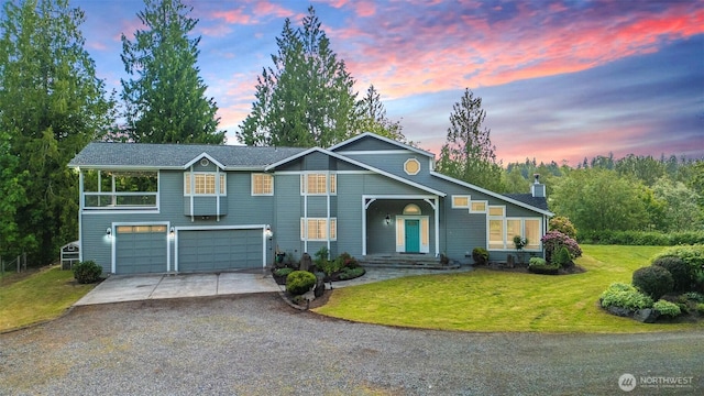 5501 55th St SE, Auburn, WA 98092 - view of front facade with concrete driveway, a garage, a front yard, and a chimney