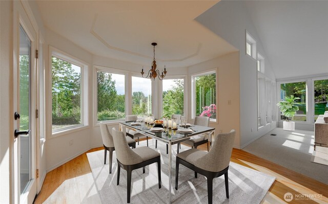 5501 55th St SE, Auburn, WA 98092 - dining area featuring plenty of natural light, a chandelier, light wood-type flooring, and baseboards