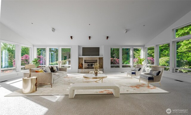 5501 55th St SE, Auburn, WA 98092 - carpeted living room with lofted ceiling and a tiled fireplace