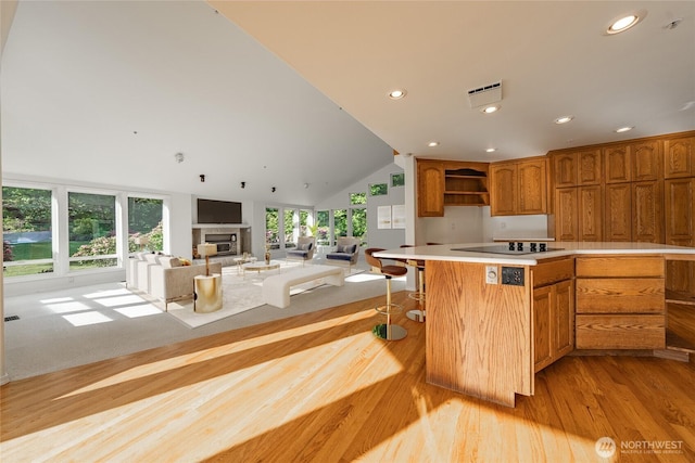 5501 55th St SE, Auburn, WA 98092 - kitchen with recessed lighting, open shelves, a fireplace, light countertops, and light wood-style flooring