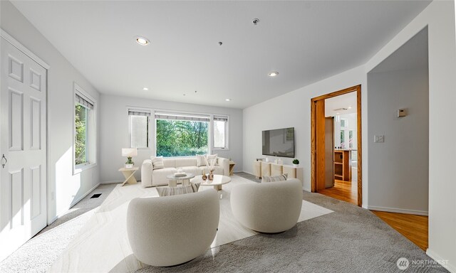 5501 55th St SE, Auburn, WA 98092 - living area with wood finished floors, recessed lighting, and baseboards