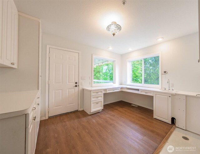 5501 55th St SE, Auburn, WA 98092 - unfurnished office featuring built in study area, wood finished floors, and a sink
