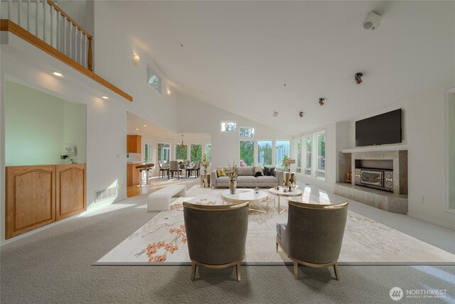 5501 55th St SE, Auburn, WA 98092 - carpeted living room featuring high vaulted ceiling and a tiled fireplace