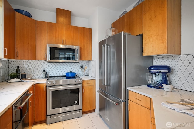 22756 SE 13th Ln Unit C6, Sammamish, WA 98075 - kitchen featuring stainless steel appliances, decorative backsplash, and brown cabinetry