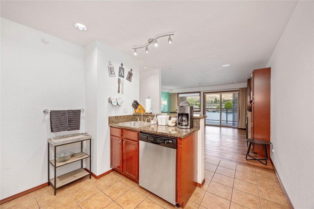 322 W Woodin Ave Unit 632, Chelan, WA 98816 - kitchen featuring dishwasher, a sink, a peninsula, light tile patterned floors, and stone countertops