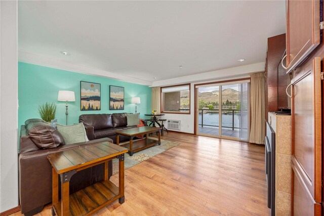 322 W Woodin Ave Unit 632, Chelan, WA 98816 - living area featuring light wood finished floors, a wall mounted air conditioner, and recessed lighting