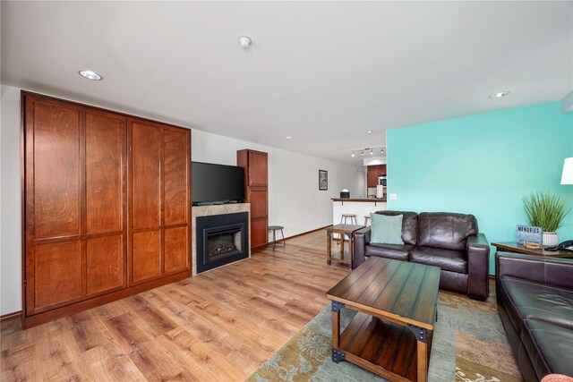 322 W Woodin Ave Unit 632, Chelan, WA 98816 - living area with light wood-type flooring, a glass covered fireplace, and recessed lighting