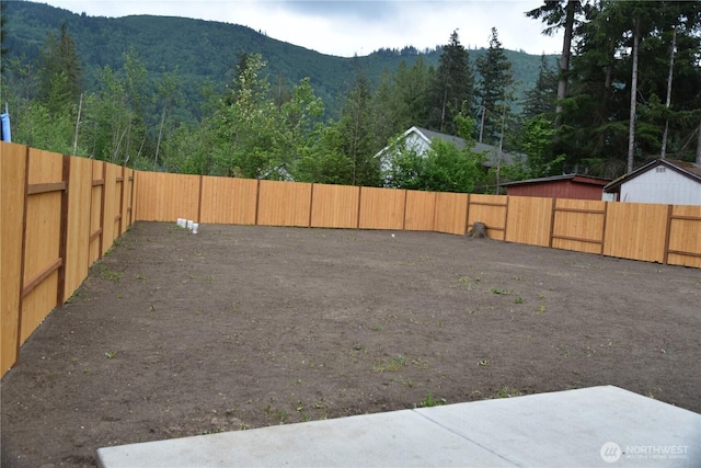 8452 Aspen Ct, Maple Falls, WA 98266 - fenced backyard featuring a mountain view and a wooded view