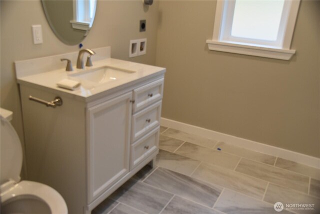 8452 Aspen Ct, Maple Falls, WA 98266 - bathroom with vanity, toilet, and baseboards