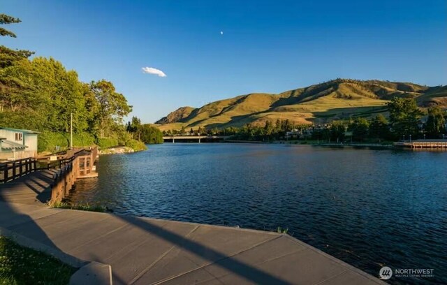 2220 W Woodin Ave Unit 303, Chelan, WA 98816 - dock with a water and mountain view