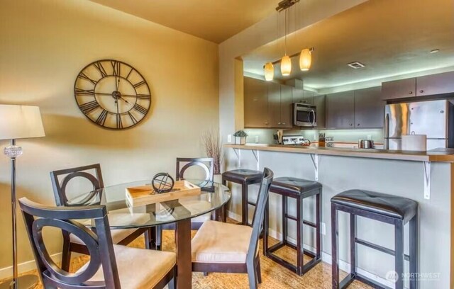 2220 W Woodin Ave Unit 303, Chelan, WA 98816 - dining area with baseboards